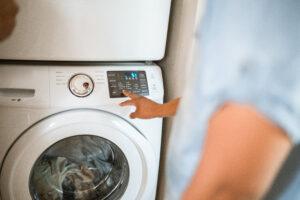 Man is stasrting Samsung front-load washer 